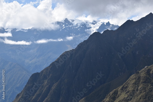 Hiking the green valleys and lush jungle and mountain landscape of the Inca Trail in Peru