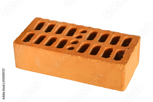 Red construction brick block with perforation, single textured object, close-up isolated on white background