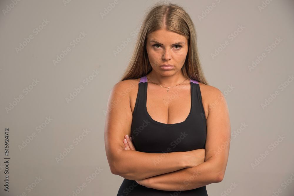 Female model in sport bra looks bored Female model in sport bra looks bored