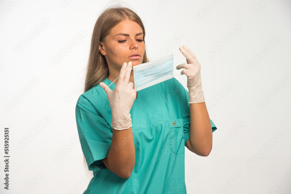 Blonde female doctor wearing face mask Blonde female doctor wearing face mask