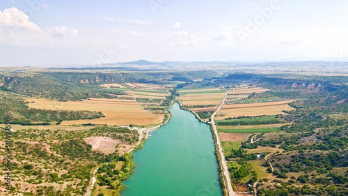 Aerial view of the dam pond between agricultural fields 
