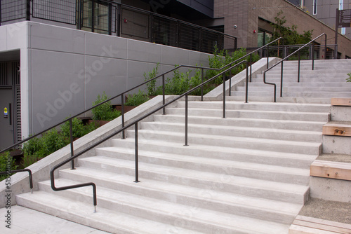 Stairway with steel banister to apartment complex from bottom of stairway 1