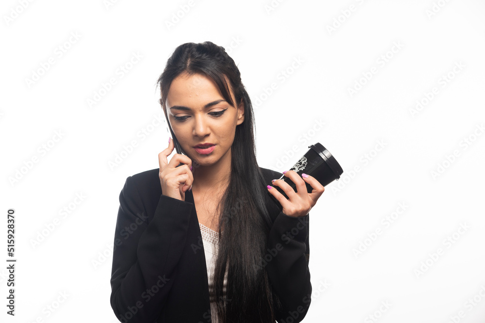 Business woman talking on cellphone on white background Business woman talking on cellphone on white background