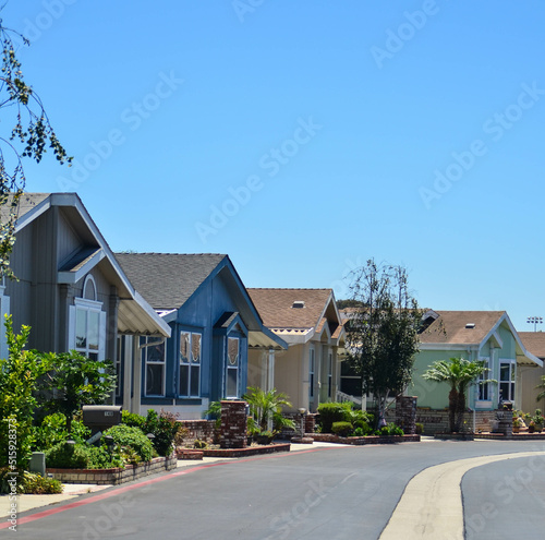 Houses lined up on a quiet suburban street in a neighborhood