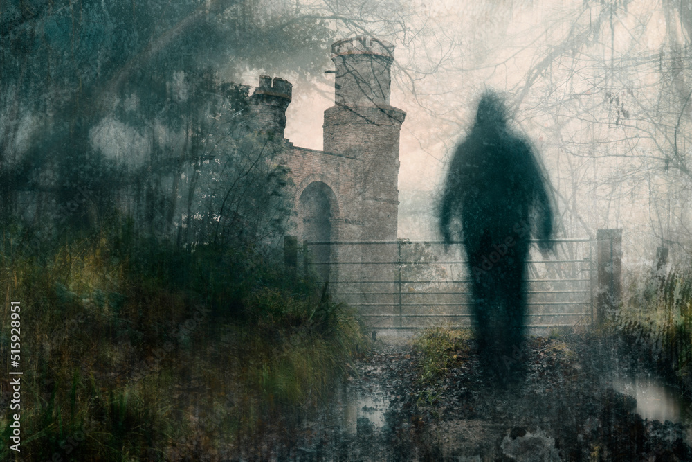 A double exposure of spooky castle. With a blurred ghostly figure on a path in a forest on a bleak winters day