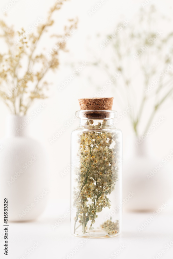 Dried herbal flowers with bottle. Homeopathy background. Dried herbal flowers with bottle. Homeopathy background.