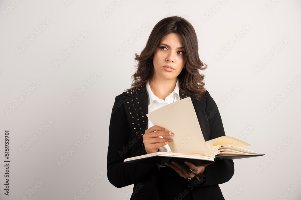 Female teacher thinking about something on white background