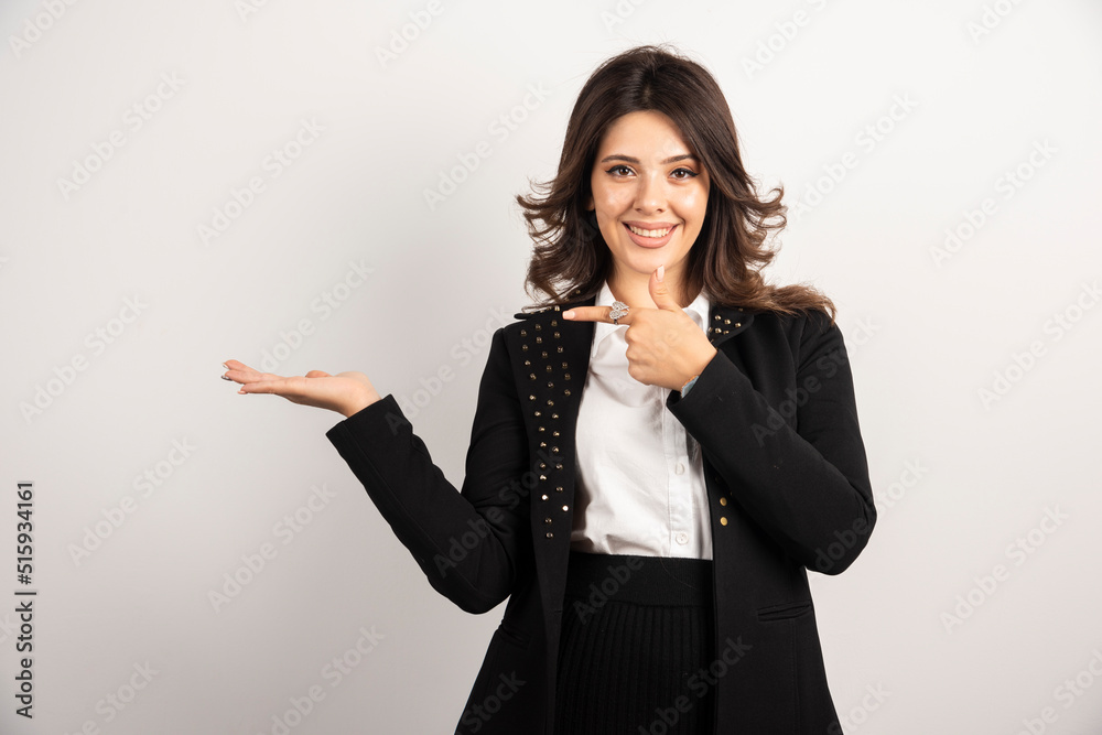Surprised woman in black jacket covered her ears Surprised woman in black jacket covered her ears