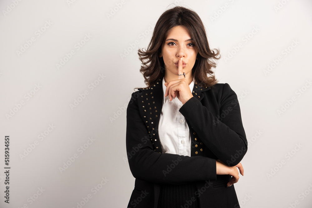 Confident employee making slient gesture Confident employee making slient gesture