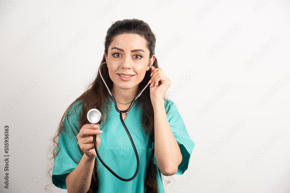Portrait of smiling female healthcare worker posing with stethoscope Portrait of smiling female healthcare worker posing with stethoscope