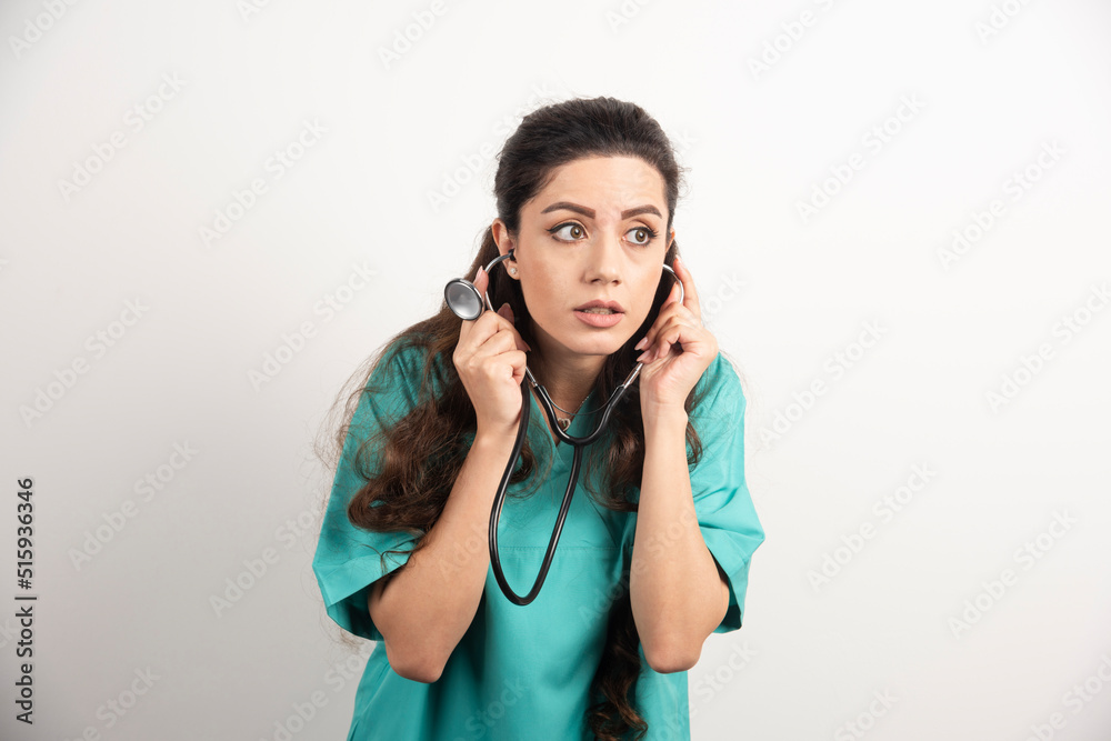 Young woman doctor in uniform with stethoscope Young woman doctor in uniform with stethoscope