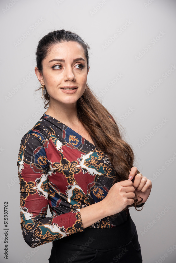 Woman with ponytail hair looking at somewhere Woman with ponytail hair looking at somewhere