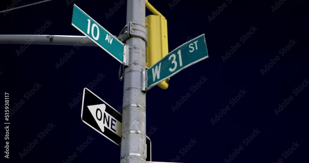New York City, Avenue and Street sign at night. Illuminated intersection signs New York City, Avenue and Street sign at night. Illuminated intersection signs