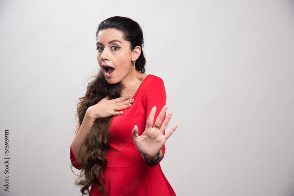 Young woman showing her denial with NO on her hand Young woman showing her denial with NO on her hand