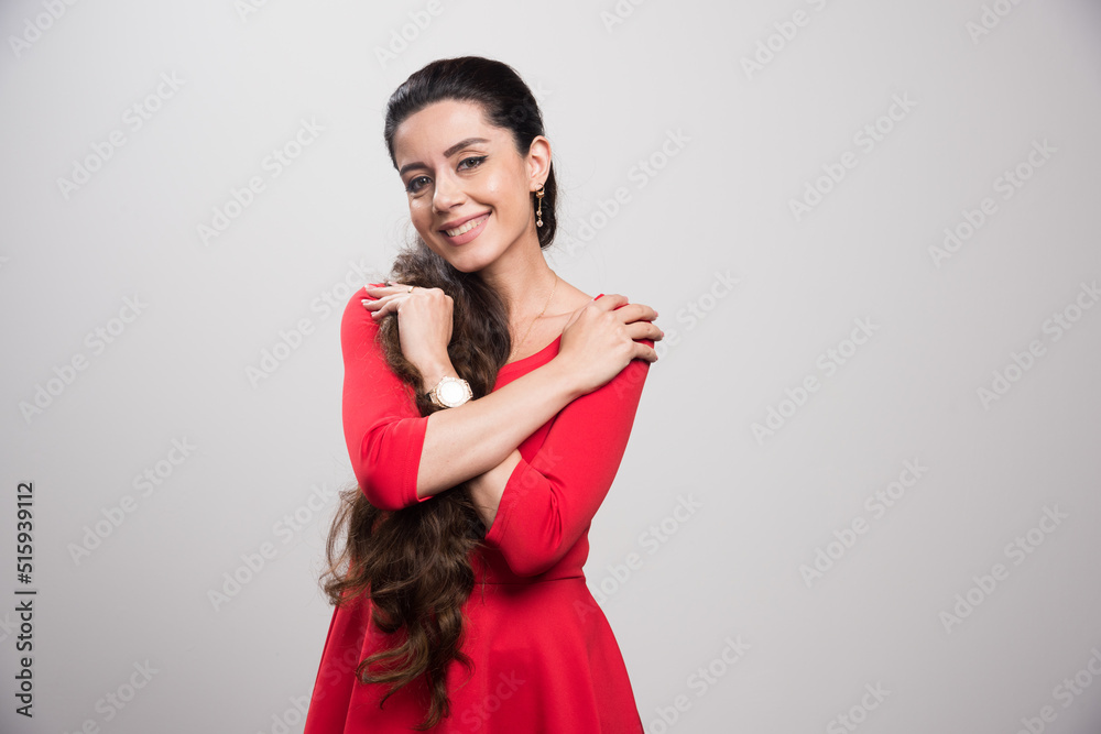 Young pretty girl smiling in a red dress Young pretty girl smiling in a red dress