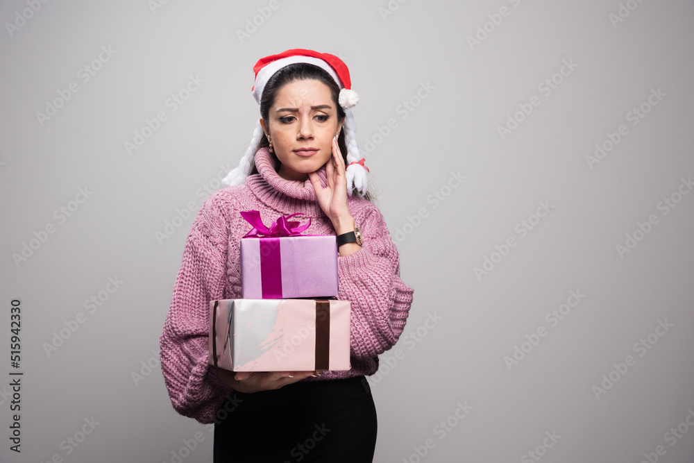 Charming lady in stylish holiday dress looking at away with happiness and calmness Charming lady in stylish holiday dress looking at away with happiness and calmness