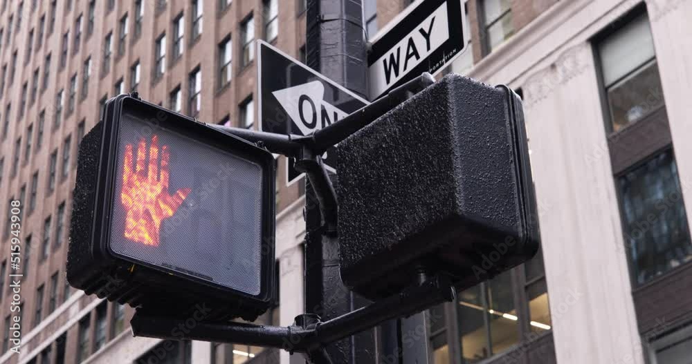 Pedestrian Traffic light in NYC switching from walk to don't walk with countdown. Pedestrian safety in Manhattan, new York City