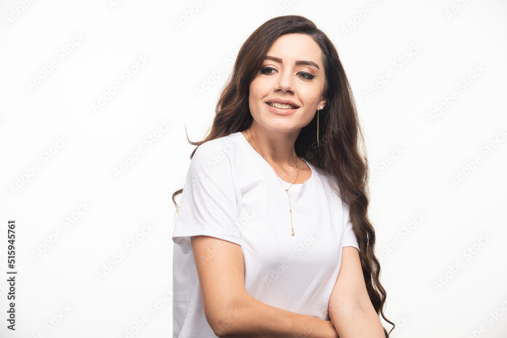 Attractive woman in white shirt posing on white background Attractive woman in white shirt posing on white background