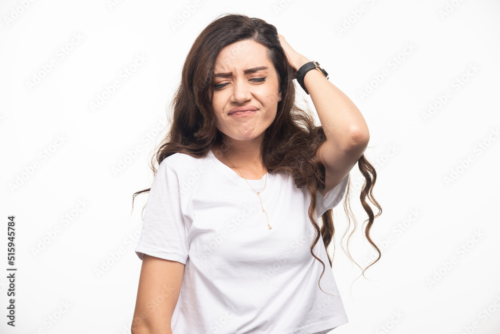Young pretty woman in white shirt feeling pain Young pretty woman in white shirt feeling pain