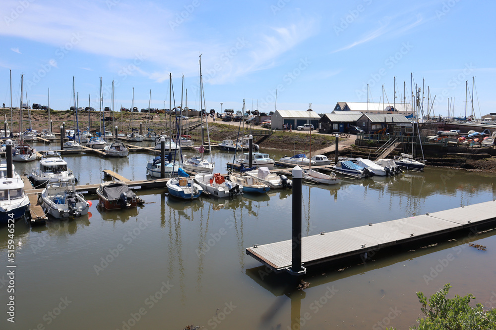 AXMOUTH, DEVON,ENGLAND - JULY 12TH 2020: Yachts and other boats in the marina at Axmouth on a beautiful sunny summers day. A pontoon can be seen in the foreground