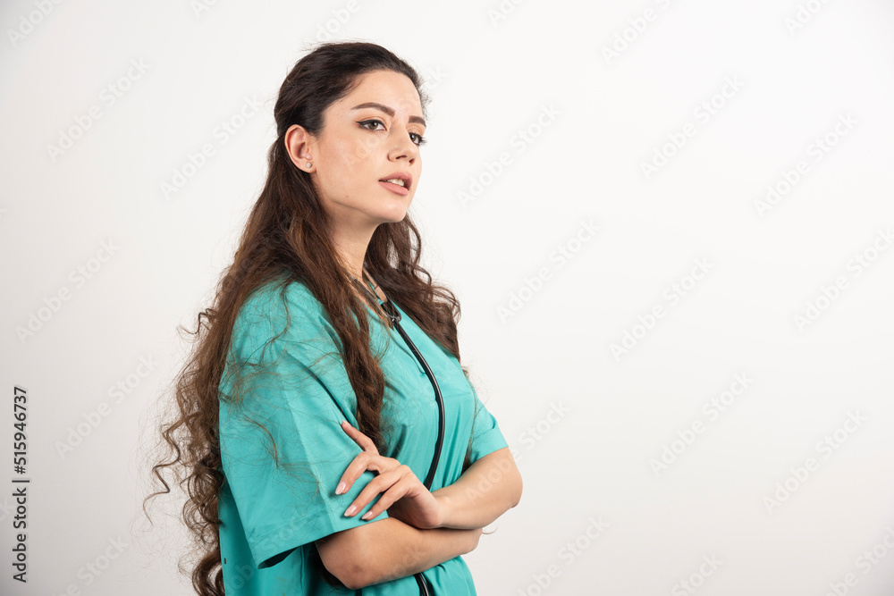 Portrait of female healthcare worker posing with crossed hands Portrait of female healthcare worker posing with crossed hands