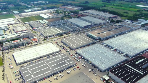 Aerial footage of a large shopping centre and car parks located in the city photo