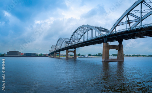 Centennial Bridge over the Mississippi River and the curved bike trails and footpaths, the view from  LeClaire Park and Bandshell in Davenport, Iowa photo