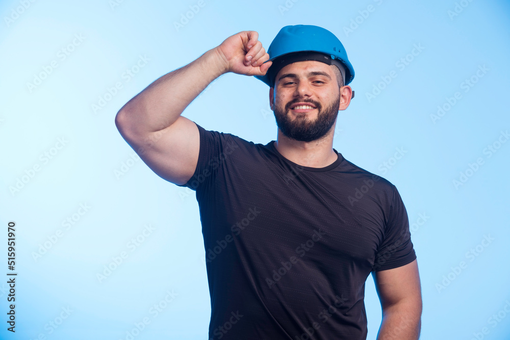 Construction worker in blue helmet