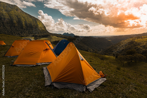 Fotografering Tents at base camp at sunrise, golden hour