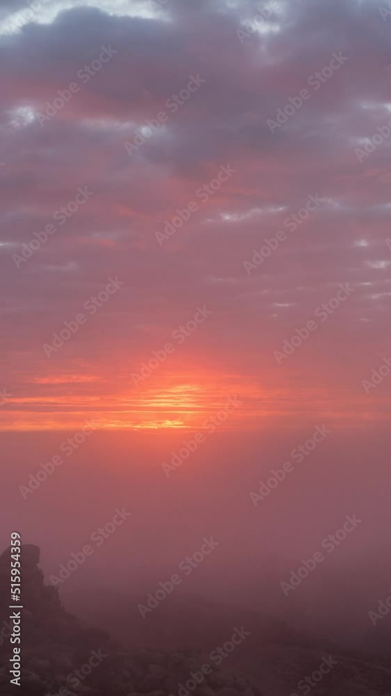 Los Angeles foggy sunrise vertical video time lapse.  Shot from Rocky Peak mountain above the San Fernando Valley.