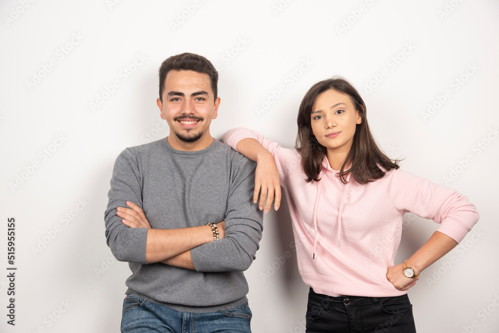 Young couple standing with happy expression Young couple standing with happy expression
