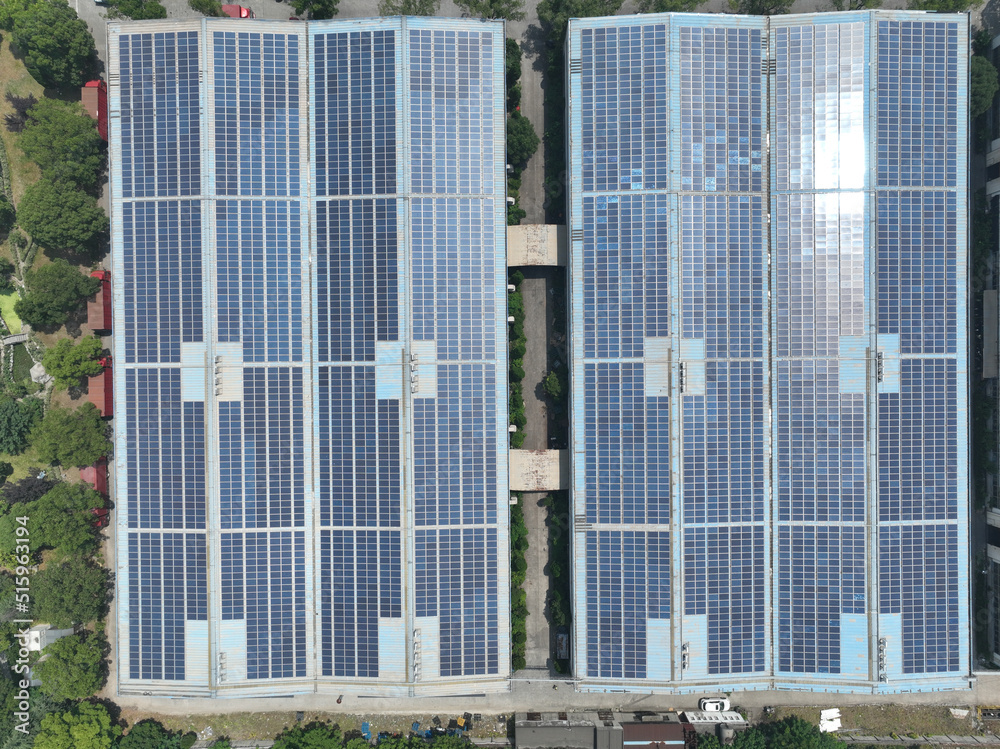 Obraz premium solar panels on factory rooftop
