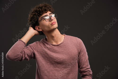 Young boy with curly hairstyle wearing eyeglasses © azerbaijan-stockers