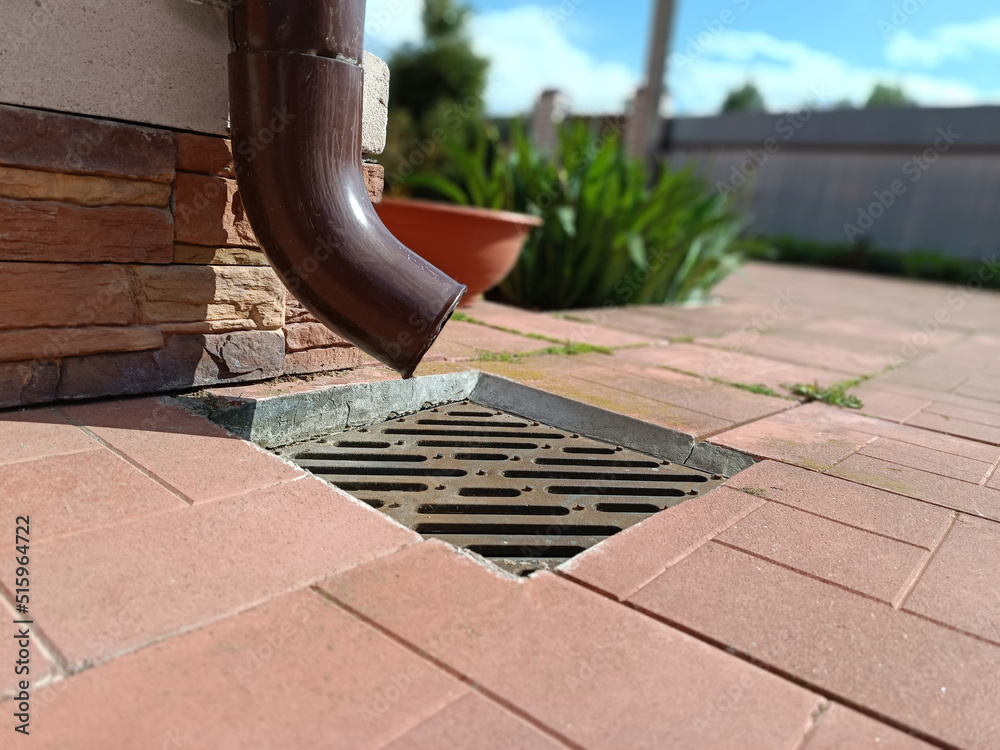 Plastic drain pipe with a drain pipe shoe at the end. Attaches to a