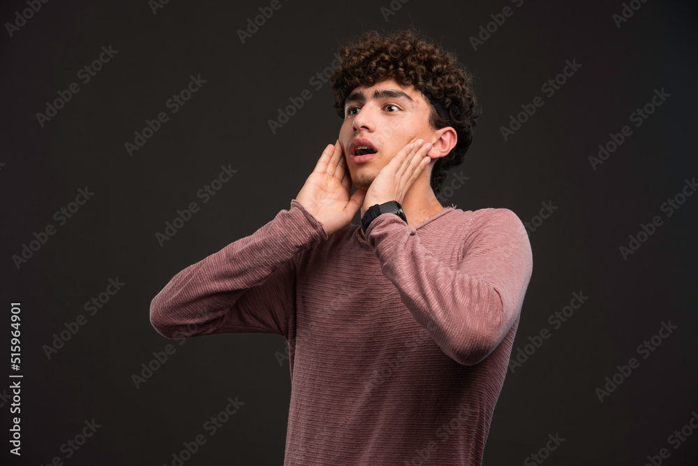 Young model with curly hairs gets surprized Young model with curly hairs gets surprized