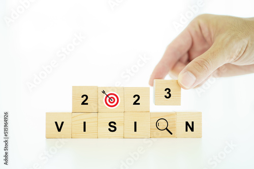 Word vision and mission on a wooden blocks, business strategic planning concept.