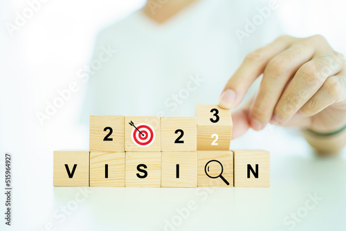 Word vision and mission on a wooden blocks, business strategic planning concept.