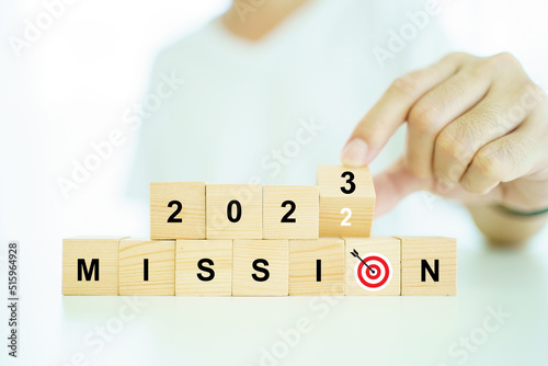 Word vision and mission on a wooden blocks, business strategic planning concept.