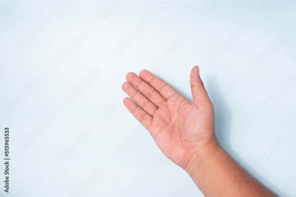 hand gesture of opening the palm of the hand, the concept of inviting, or offering and apologize. top view hand gesture of opening the palm of the hand, the concept of inviting, or offering and apologize. top view