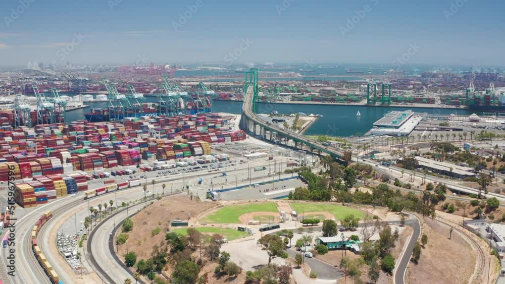Aerial shot of Thomas Vincent Bridge and Los Angeles Harbor ships and freight Aerial shot of Thomas Vincent Bridge and Los Angeles Harbor ships and freight