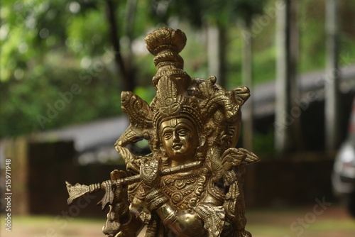 Obraz na płótnie Lord krishna brass idol in golden color
