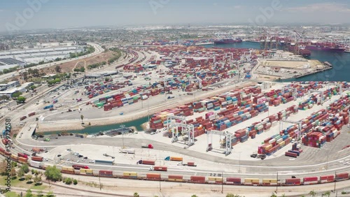 Aerial orbit shot of cargo, freight, shipping containers in Los Angeles Harbor photo