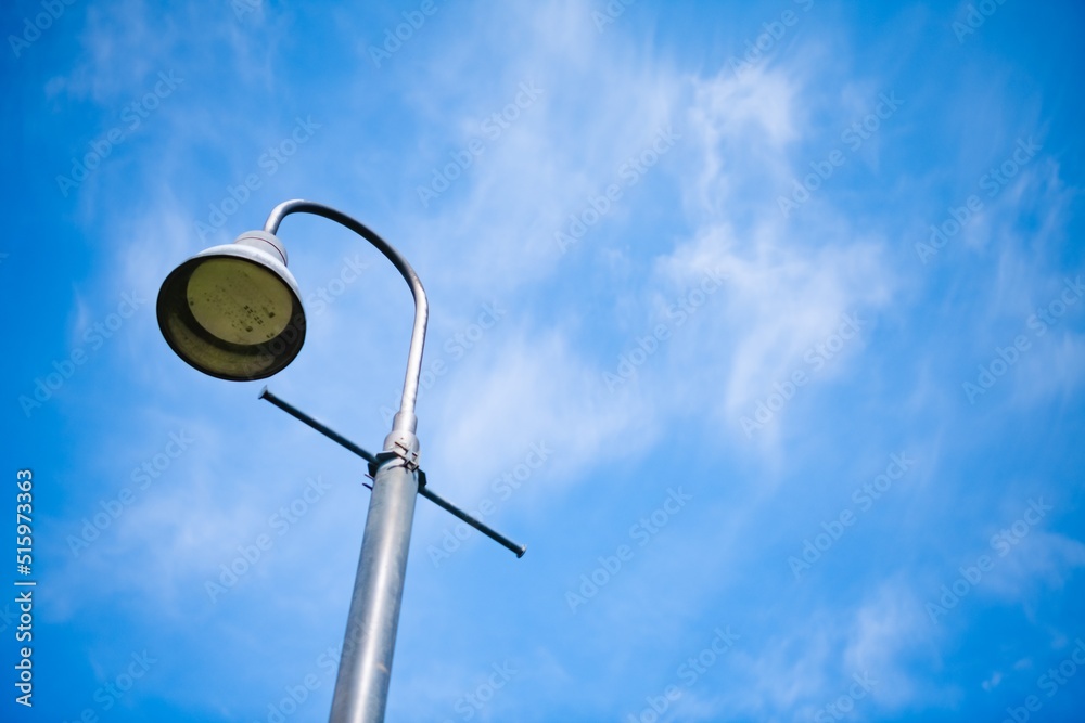 lamp post against blue sky