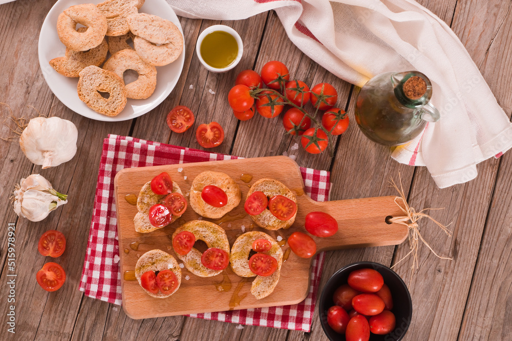 Friselle with cherry tomatoes and salt.
