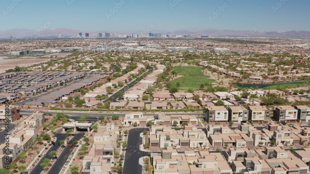 Aerial shot of rich residential neighborhood with city strip skyline casinos Aerial shot of rich residential neighborhood with city strip skyline casinos