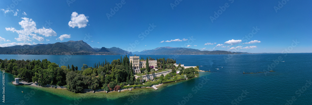Panorama of Garda Island located on Lake Garda in Italy. Aerial panorama of the island of Garda. Historic Venetian Neo-Gothic villa on Lake Garda.