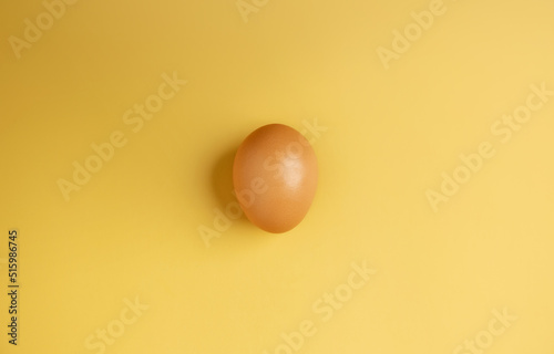 Egg Lay on Yellow Background. Raw Fresh Food. Clean and Minimal. Top View