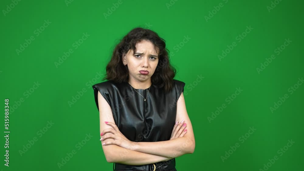 Young girl with sad expression standing while pouting Young girl with sad expression standing while pouting