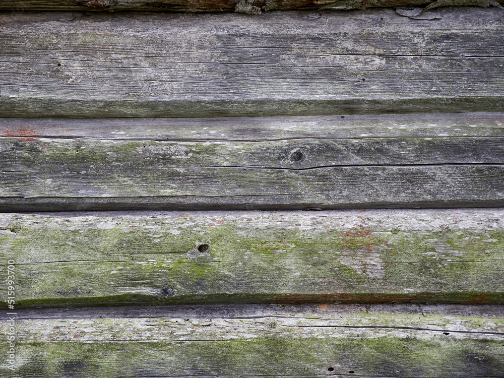 Ancient wooden walls. Old logs in the wall. Ancient wooden walls. Old logs in the wall.