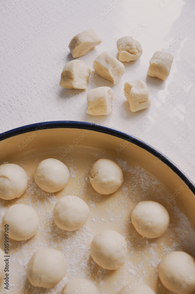 Close up of female hands preparation of dough for Baklava, homemade Baklava with walnuts, old style traditional Turkish recipe, Food pastry Close up of female hands preparation of dough for Baklava, homemade Baklava with walnuts, old style traditional Turkish recipe, Food pastry